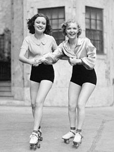 vintage-black-and-white-young-women-roller-skating-friends